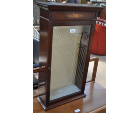 A small mahogany and marquetry decorated hanging display cabinet with a glazed door, width 39 cm