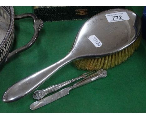 A silver backed dressing table brush, and a child's silver knife and fork