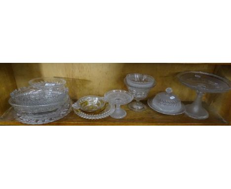 A shelf of Victorian and other pressed glass comports, bowls etc