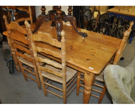 A polished pine rectangular farmhouse kitchen table, together with a set of 4 beech ladder back and rush seated chairs, table