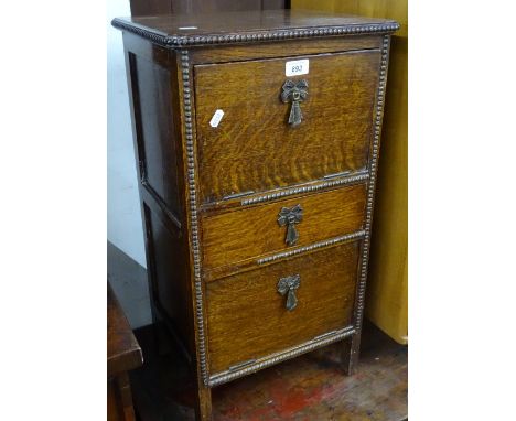 1920s oak sewing cabinet with 2 full fronts and fitted drawe, width 35cm