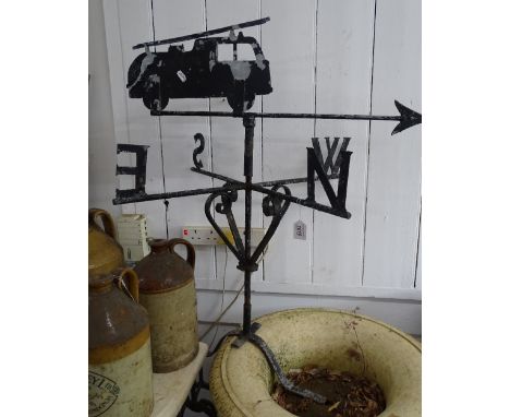 A painted wrought iron weather vane