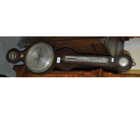A 19th century rosewood wheel barometer and thermometer, with dry / damp dial and mercury thermometer, silvered dial, and the