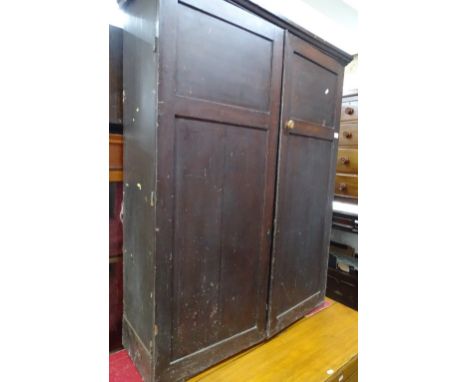 A Victorian stained oak and pine cabinet, with 2 panel doors opening to reveal fitted pigeon holes, width 94 cm 