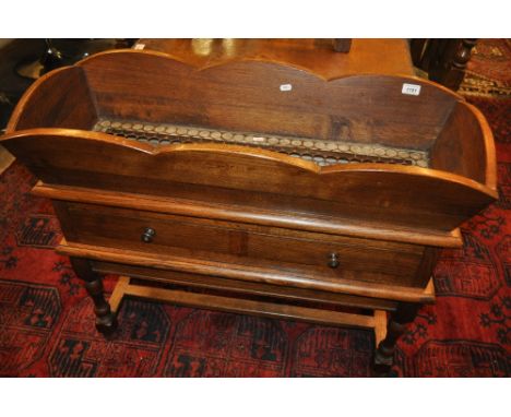 A Continental oak plant trough on drawer fitted stand, width 94 cm