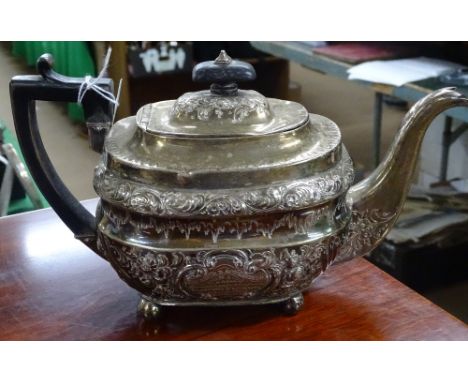 A George III silver teapot with all-over embossed decoration, and engraved cartouche, London 1808, makers marks HN & RH