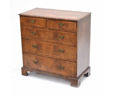 Georgian style walnut veneered chest of drawers, the cross banded moulded top over two short and three long graduate drawers,