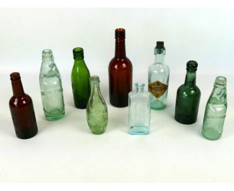 Interesting collection of vintage glass advertising bottles of Weymouth and Dorset interest, including an H. Bowrings Lemonad