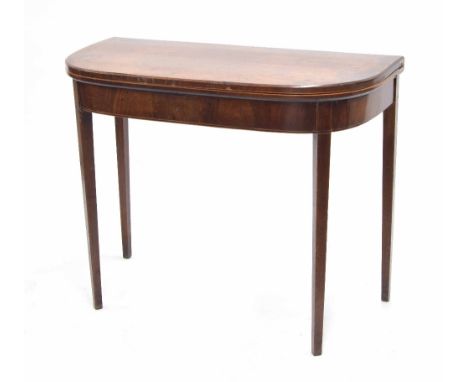 Georgian mahogany foldover card table, the foldover top with inlaid banding, enclosing green baize surface, raised on slender