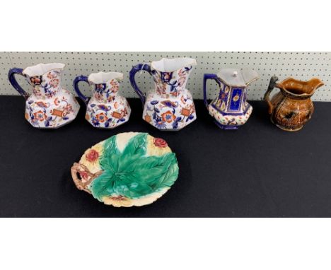 Graduated pair of K &amp; Co. facet jugs, decorated in an Imari palette with serpent handles, tallest 8" high; together with 