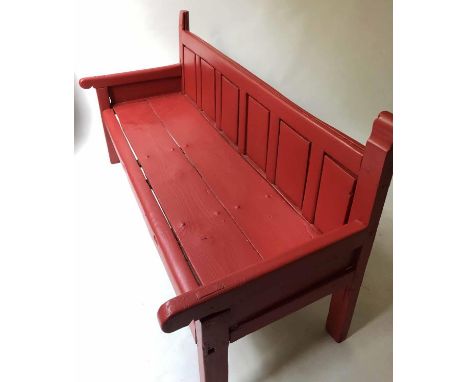 ANTIQUE BENCH, red painted pine with panelled back and arms, 170cm W. 