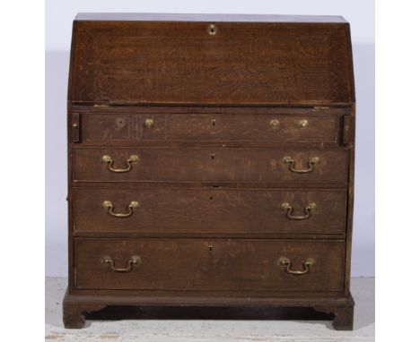 George III oak bureau, fitted interior with drawers, cupboard and pigeonholes, fitted with four long graduating drawers, brac