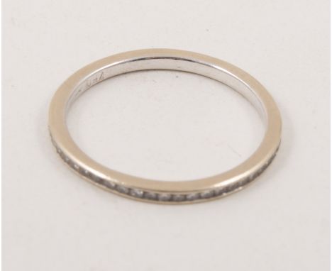 A diamond full eternity ring, the diamonds set in a 1.5mm wide white metal mount stamped 750, ring size M. 