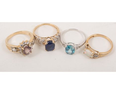 Four 9 carat gold stone set dress rings, hallmarked 9 carat yellow and white gold and set with opal and other coloured stones