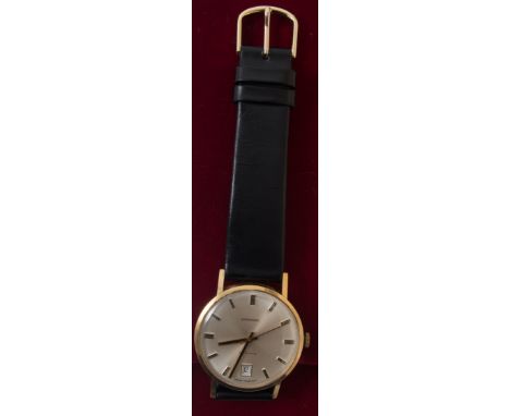 A gentleman's Garrard wrist watch, circular cream baton dial with date aperture and sweep seconds in a yellow metal case with