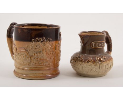 Fulham type stoneware mug, moulded decoration of hunting incidents, 11cm; and a stoneware jug, The Old Musty. (2)