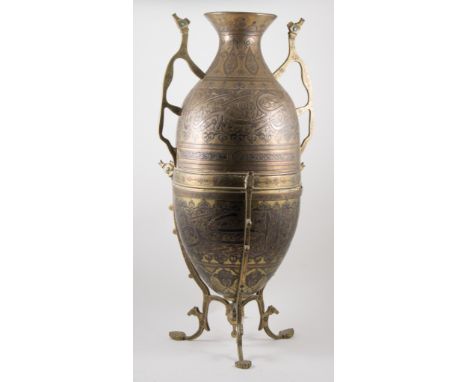 Persian brass and white metal floor vase, twin handles, tripod stand, height 76cm.