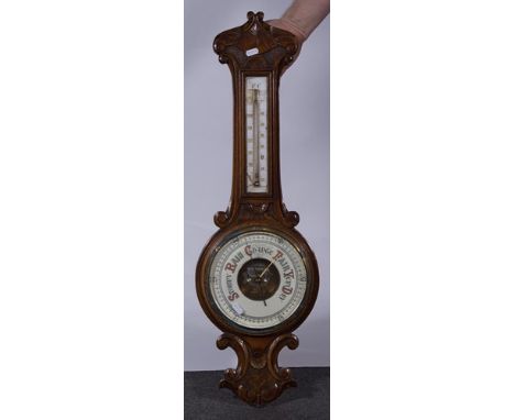 Wall mounted aneroid barometer with thermometer, carved oak case, 82cm.