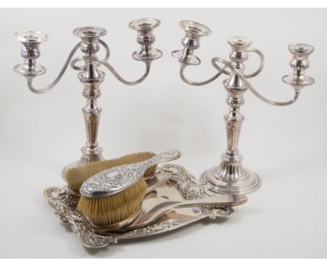 Silver repousse chased tray,William Hutton & Sons, Birmingham 1905, three silver backed brushes, and a silver backed hand mir