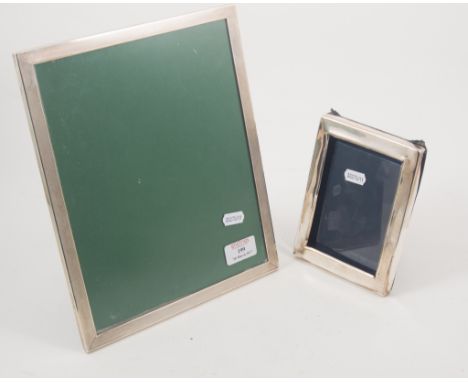 A silver mounted photograph frame, rectangular form, engine turned decoration, 28cm x 23cm, easel back, and another smaller s