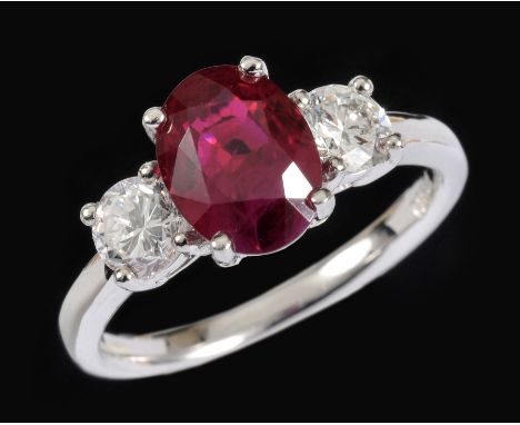 A Madagascan Ruby and Diamond three stone Ring claw-set oval-cut ruby, 2.31cts, between two brilliant-cut diamonds, total dia