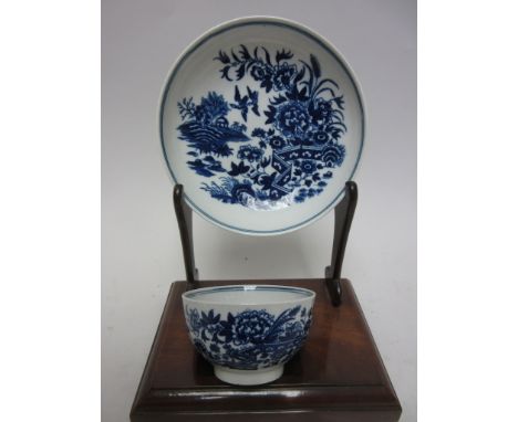 A pair of early Worcester blue and white Tea Bowls and Saucers printed fence pattern, crescent mark