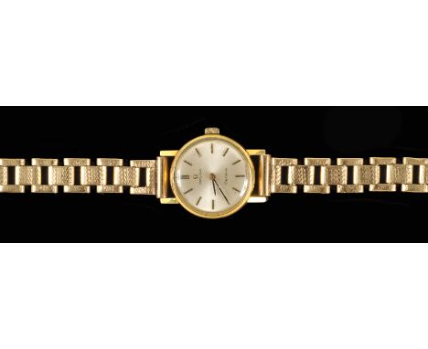 A Lady's Omega manual Wristwatch the silvered dial with hourly baton markers in gold plated case on 9ct gold bracelet