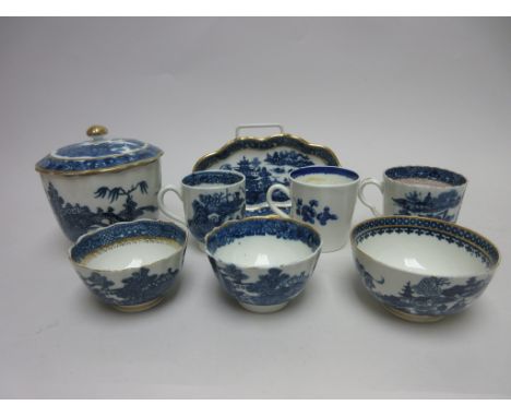 A Caughley blue and white Spoon Tray, lidded Sucrier, a Cup and two Tea Bowls all printed chinoiserie landscapes with gilt ri