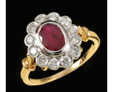 A Ruby and Diamond Cluster Ring rub over-set oval-cut ruby within frame of twelve brilliant-cut diamonds in 18ct white and ye