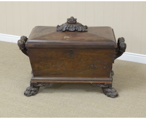 A William IV mahogany large Cellaret of sarcophagus shape with zinc lined interior divisions, leafage and bud carved finial, 