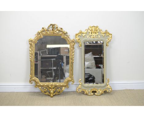 A 19th Century Upright Wall Mirror with shaped bevelled plate, grey and gilt painted surround with mask surmount, 35 x 18in, 