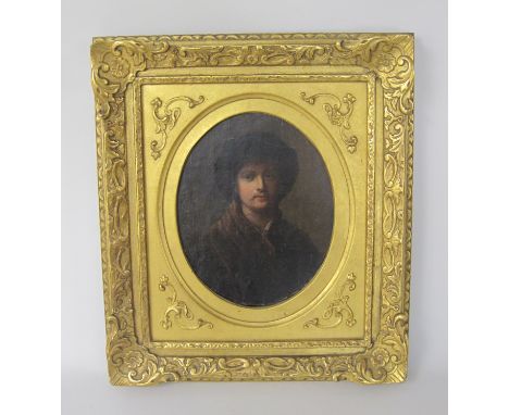 FOLLOWER OF REMBRANDT VAN RIJN (1606-1669)Portrait of a man, half-length, wearing brown costume and dark hatoil on panel9 1/2