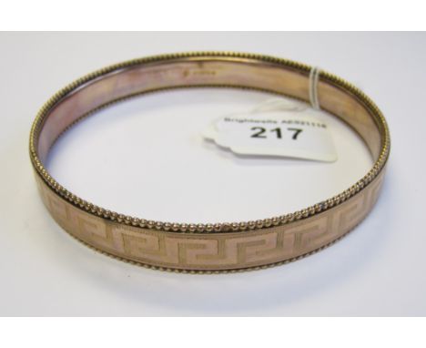 A 9ct gold Slave Bangle engraved Greek key design, approx 19gms