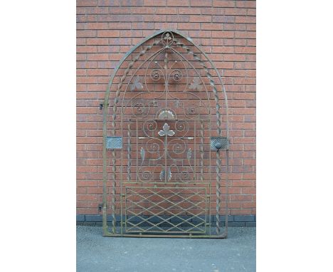 A Victorian heavy wrought iron Garden Gate of pointed arched form with spiral, floral and scroll design, 4ft wide, 6ft 9in hi