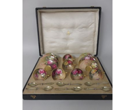 A cased set of Royal Worcester Coffee Cups and Saucers painted pink and yellow roses, chiefly signed by W. H. Austin, and six