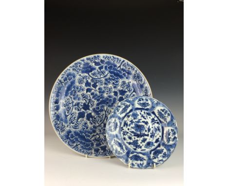 Two 18th Century Chinese blue and white porcelain DishesThe Charger painted all over with scrolling peony, probably Qianlong,