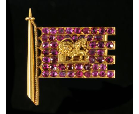 A Ruby Flag Brooch pavé-set numerous oval-cut stones with griffin motif to centre