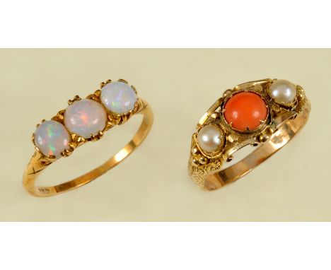 An Opal three stone Ring claw-set circular cabochons, ring size Q 1/2 and a Coral and half Pearl Ring in intricate mount, rin