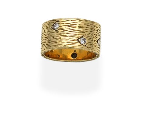 KUTCHINSKY: DIAMOND-SET RING, 1964Of textured finish, set with brilliant-cut diamonds, mounted in 18 carat gold, signed Kutch