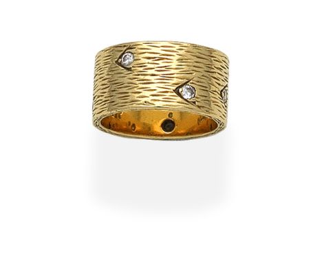 KUTCHINSKY: DIAMOND-SET RING, 1964Of textured finish, set with brilliant-cut diamonds, mounted in 18 carat gold, signed Kutch