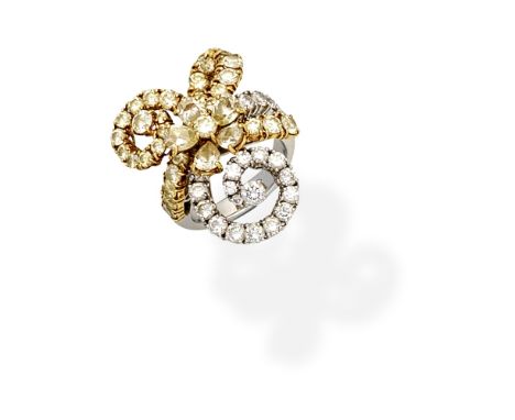 DIAMOND AND COLOURED DIAMOND DRESS RINGOf floral and swirl design, set with brilliant-cut diamonds and pear-shaped and brilli