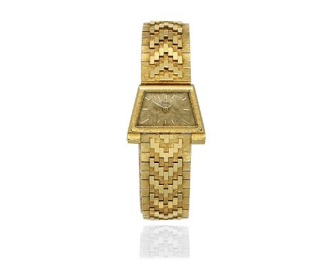 PIAGET: GOLD WRISTWATCH, 1963The trapezoid-shaped dial with baton hourmakers, within an engine-turned bezel, on a strap of po