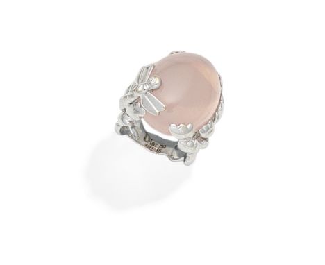 DIOR: ROSE QUARTZ AND DIAMOND DRESS RINGThe rose quartz cabochon within an openwork foliate mount with dragonfly decoration, 