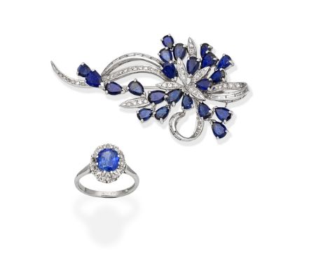 SAPPHIRE AND DIAMOND CLUSTER RING; SAPPHIRE AND DIAMOND BROOCH1st: The ring set with a cushion-shaped sapphire, within a sing