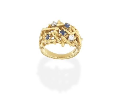 KUTCHINSKY: SAPPHIRE AND DIAMOND-SET RING, 1970Of abstract design and textured finish, accented with circular-cut sapphires a