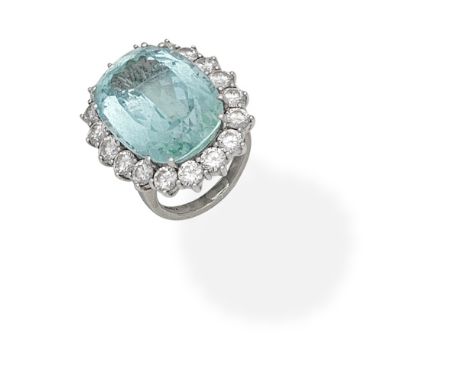 AQUAMARINE AND DIAMOND CLUSTER RINGSet with a rectangular cushion-shaped aquamarine within a brilliant-cut diamond surround, 