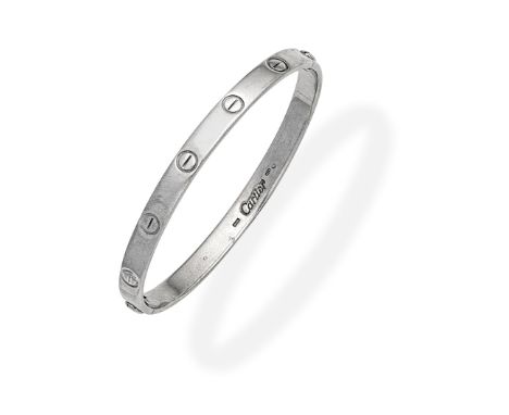 CARTIER: LOVE BANGLEWith screwhead motifs,  signed Cartier, Swiss assay mark,  inner circumference approx. 16.5cm, maker's po