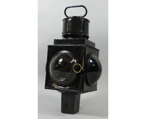 A Railway Crossing gate lamp, painted black with red a clear lens, 44 cm. 