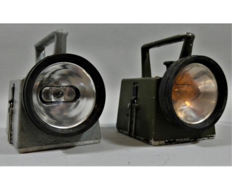 Two Bardic lamps and an empty lamp case, no lenses.