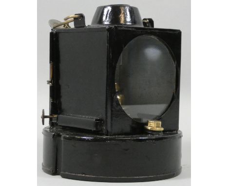 A round based black painted signal lamp with burner. 